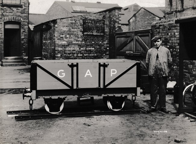 hc worker posed with miniature wagon wdo